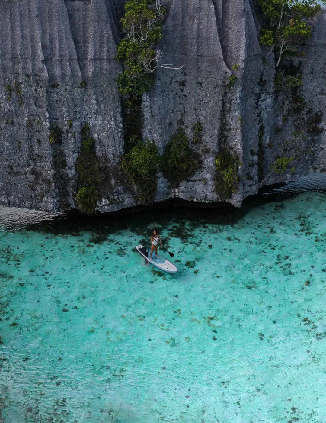 Limestone islands and turquoise lagoons of Raja Ampat from the air